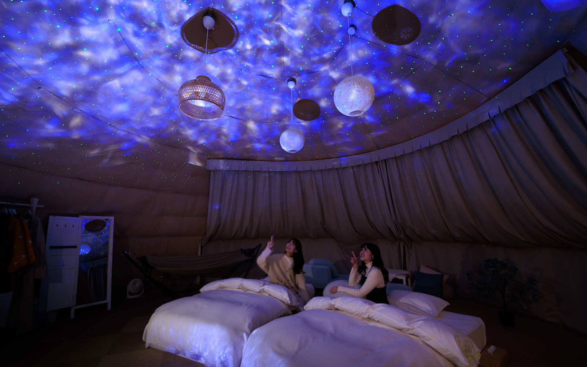 Women enjoying the planetarium inside the dome